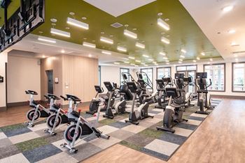 2-Story, tech advanced fitness center with cardio and strength training equipment